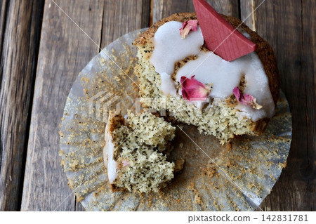A cross-section of a muffin with partially eaten tea leaves mixed in. A cross-section of a muffin with partially eaten tea leaves mixed in. 142831781