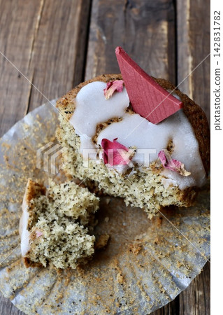 A cross-section of a muffin with partially eaten tea leaves mixed in. A cross-section of a muffin with partially eaten tea leaves mixed in. 142831782
