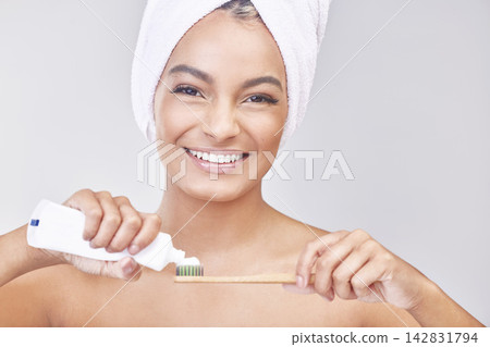 Woman, toothbrush and toothpaste with portrait in studio with oral hygiene, dental care and morning routine. Person, happy and brushing teeth for whitening, grooming and selfcare on white background Woman, toothbrush and toothpaste with portrait in studio with oral hygiene, dental care and morning routine. Person, happy and brushing teeth for whitening, grooming and selfcare on white background 142831794