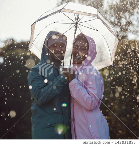 Portrait, smile and black couple with umbrella outdoor for laugh or bonding together in winter by water drop. Raincoat, happy man and woman in nature for love, protection or holding hands for support Portrait, smile and black couple with umbrella outdoor for laugh or bonding together in winter by water drop. Raincoat, happy man and woman in nature for love, protection or holding hands for support 142831853