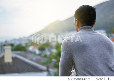Back, neighborhood and view with man on balcony of apartment for residential home ownership. Community, morning and real estate with person looking at property for growth, mortgage or investment Back, neighborhood and view with man on balcony of apartment for residential home ownership. Community, morning and real estate with person looking at property for growth, mortgage or investment 142831910