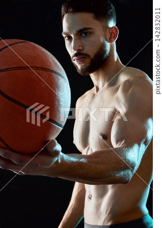 Man, fitness and sport with basketball for game, match or challenge in studio on a black background. Active male person, athlete or player with ball for exercise, training or health and wellness 142832011