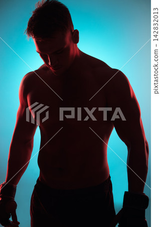 Studio, boxer or man with gloves by blue background for fitness, training and preparation for competition. Male fighter, exercise and workout with planning, thinking and wellness for boxing sports 142832013