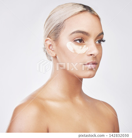 Eye pad, collagen and woman with skincare in studio with skincare, natural and beauty facial treatment. Cosmetic, health and person with gel dermatology product for face routine by white background. Eye pad, collagen and woman with skincare in studio with skincare, natural and beauty facial treatment. Cosmetic, health and person with gel dermatology product for face routine by white background. 142832030