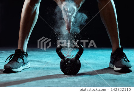 Studio, hands and chalk with kettlebell for bodybuilding, exercise and arm muscle development. Weightlifting, workout and male bodybuilder in health, fitness or power training on black background Studio, hands and chalk with kettlebell for bodybuilding, exercise and arm muscle development. Weightlifting, workout and male bodybuilder in health, fitness or power training on black background 142832110