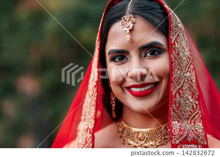 Indian, bride and wedding portrait for celebration and marriage event with Hindu fashion and style. Jewelry, makeup and woman with traditional culture and cosmetics with dress and saree for religion Indian, bride and wedding portrait for celebration and marriage event with Hindu fashion and style. Jewelry, makeup and woman with traditional culture and cosmetics with dress and saree for religion 142832672