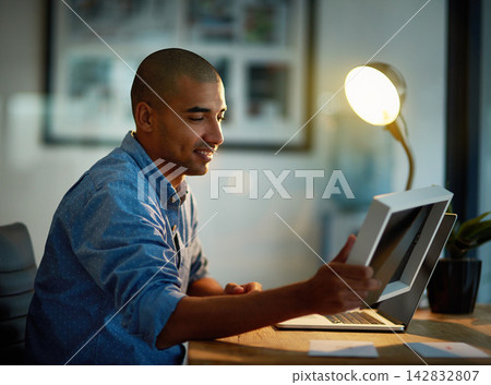 Thinking, man or photo frame at desk with laptop for late work, good memories or nostalgia at night. Happy, male editor or holding picture for sentiment in office at computer, after hours or deadline Thinking, man or photo frame at desk with laptop for late work, good memories or nostalgia at night. Happy, male editor or holding picture for sentiment in office at computer, after hours or deadline 142832807