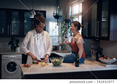 Couple, counter and cooking in kitchen at house for romantic dinner, lunch and date with love. People, happy and salad meal prep in home for happiness, wellness and eating food with alcohol or wine Couple, counter and cooking in kitchen at house for romantic dinner, lunch and date with love. People, happy and salad meal prep in home for happiness, wellness and eating food with alcohol or wine 142832977
