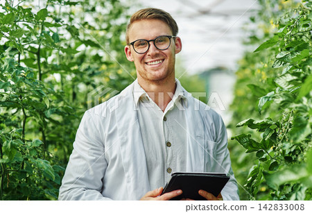 Outdoor, agronomist or man with tablet in portrait for plant research, crop production or info on agriculture. Nature, male scientist and digital for quality inspection, growth or tomato tree monitor Outdoor, agronomist or man with tablet in portrait for plant research, crop production or info on agriculture. Nature, male scientist and digital for quality inspection, growth or tomato tree monitor 142833008