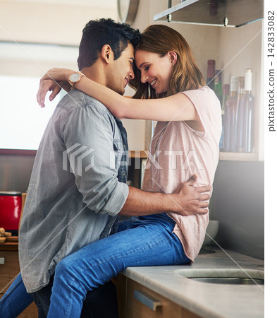 Couple, people and happy in kitchen counter with forehead touch to relax for bonding, love and support. Home, relationship and romance with smile or affection for fun, enjoy and care on break Couple, people and happy in kitchen counter with forehead touch to relax for bonding, love and support. Home, relationship and romance with smile or affection for fun, enjoy and care on break 142833082