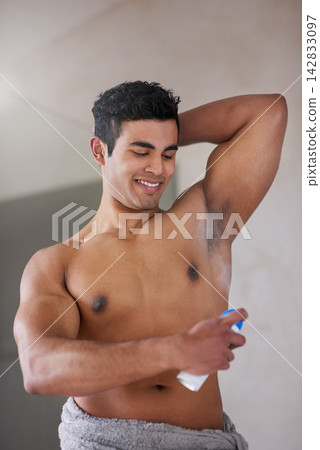 Man, shirtless and deodorant spray in bathroom for morning routine, skincare with shower for perfume. Male person, home and body scent for armpit with smile for wellness, happiness in New York City Man, shirtless and deodorant spray in bathroom for morning routine, skincare with shower for perfume. Male person, home and body scent for armpit with smile for wellness, happiness in New York City 142833097