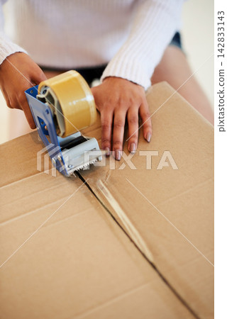 Box, hands and woman with tape at home for moving, cardboard and package for real estate or property. Closeup, person and girl with adhesive, parcel and product with safety and mortgage in lounge Box, hands and woman with tape at home for moving, cardboard and package for real estate or property. Closeup, person and girl with adhesive, parcel and product with safety and mortgage in lounge 142833143