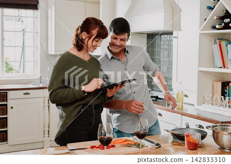 Home, cooking and couple with tablet, typing and internet for recipe, online video and social media. Apartment, man and woman in kitchen, technology and digital app with ingredients and connection Home, cooking and couple with tablet, typing and internet for recipe, online video and social media. Apartment, man and woman in kitchen, technology and digital app with ingredients and connection 142833310