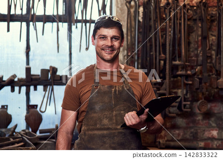 Happy, metal worker and portrait in workshop with clipboard for manufacturing, welding and blacksmith. Tradesman, smiling and confident in factory with tools for artisan, craftsman and manual labor Happy, metal worker and portrait in workshop with clipboard for manufacturing, welding and blacksmith. Tradesman, smiling and confident in factory with tools for artisan, craftsman and manual labor 142833322