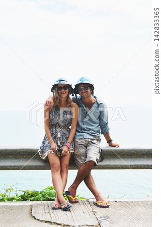 Happy, travel and couple with sunglasses for vacation, adventure or holiday together. Smile, summer and portrait of young man and woman on fun outdoor weekend trip with helmets in New Zealand. 142833365