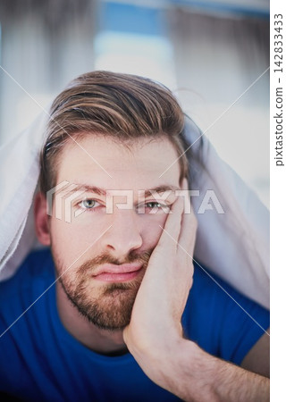 Tired, bored or portrait of man in bed for resting with fatigue or peace alone in home, morning or house. Face, relax or male person in apartment on break, time off or pillow to start day or chill Tired, bored or portrait of man in bed for resting with fatigue or peace alone in home, morning or house. Face, relax or male person in apartment on break, time off or pillow to start day or chill 142833433