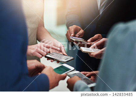Business people, group and hands with cellphone or networking connection, signal or teamwork. Colleagues, smartphone and huddle together for b2b collaboration or research, syncing or project planning Business people, group and hands with cellphone or networking connection, signal or teamwork. Colleagues, smartphone and huddle together for b2b collaboration or research, syncing or project planning 142833485