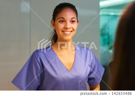 Hospital, greeting and nurse with patient, smile and service of medical help, woman and intern. Clinic, employee and friendly to person, happy and healthcare for wellness, healing and consultation Hospital, greeting and nurse with patient, smile and service of medical help, woman and intern. Clinic, employee and friendly to person, happy and healthcare for wellness, healing and consultation 142833486