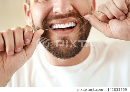 Man, dental and floss in morning for teeth cleaning in bathroom with wellness, healthy and oral hygiene. Routine, happy and fresh breath for grooming or care on weekend with closeup in Switzerland. Man, dental and floss in morning for teeth cleaning in bathroom with wellness, healthy and oral hygiene. Routine, happy and fresh breath for grooming or care on weekend with closeup in Switzerland. 142833569