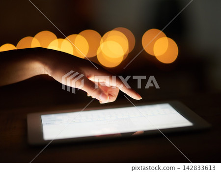 Hands, night and person with tablet, screen and typing with internet, connection and social media. Lights, closeup and human with technology, digital app and online news with email and website info Hands, night and person with tablet, screen and typing with internet, connection and social media. Lights, closeup and human with technology, digital app and online news with email and website info 142833613