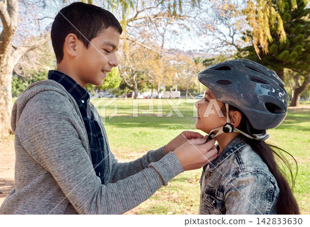 Bicycle, safety and brother help girl with helmet and learning to ride in neighborhood, park or outdoor, Happy, siblings and trust support in family with kids cycling together in summer playground Bicycle, safety and brother help girl with helmet and learning to ride in neighborhood, park or outdoor, Happy, siblings and trust support in family with kids cycling together in summer playground 142833630