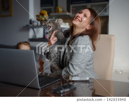 Remote Working Mother Balancing Home and Career Remote Working Mother Balancing Home and Career 142833948