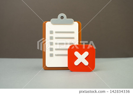 A paper tablet and a rejection sign. Test failed, inspection failed. Denial of hiring or employment. Concept of setbacks and unsuccessful job applications today. A paper tablet and a rejection sign. Test failed, inspection failed. Denial of hiring or employment. Concept of setbacks and unsuccessful job applications today. 142834336