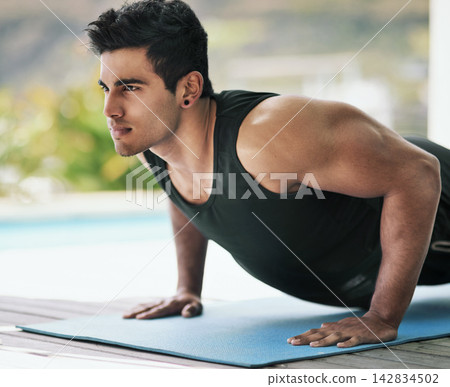 Push up, home or man in fitness training, exercise or workout for wellness, routine or balance. Ready, abs challenge or serious athlete on mat with strong arms for muscles, activity or body mobility Push up, home or man in fitness training, exercise or workout for wellness, routine or balance. Ready, abs challenge or serious athlete on mat with strong arms for muscles, activity or body mobility 142834502
