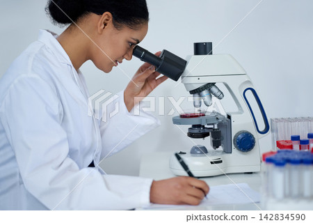Woman, science and microscope for research, notes or dna blood analysis in lab. Scientist, microbiology and test on medical equipment, chemistry or writing biotechnology study for health innovation Woman, science and microscope for research, notes or dna blood analysis in lab. Scientist, microbiology and test on medical equipment, chemistry or writing biotechnology study for health innovation 142834590