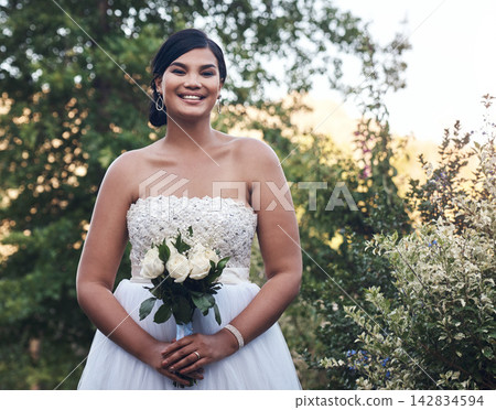 Bride, portrait and happy by wedding in garden for marriage celebration, event and confident or excited for future commitment. Woman, dress and nature with pride for embrace, connection and promise. Bride, portrait and happy by wedding in garden for marriage celebration, event and confident or excited for future commitment. Woman, dress and nature with pride for embrace, connection and promise. 142834594