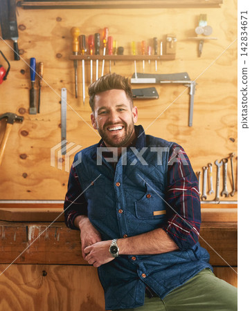 Man, contractor and portrait with smile in workshop for career, renovation or maintenance services. Male carpenter, wood workbench and happiness for job in construction, home project or repair work Man, contractor and portrait with smile in workshop for career, renovation or maintenance services. Male carpenter, wood workbench and happiness for job in construction, home project or repair work 142834671