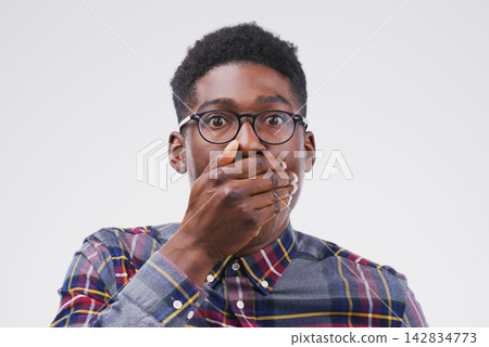 Surprise, announcement and portrait of black man with news and info on white background in studio. Shocked, face and college student with crazy secret, gossip or reaction to drama at university 142834773