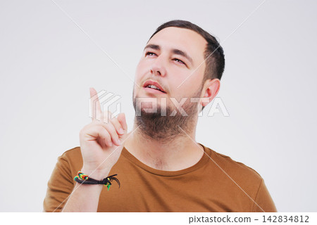 Thinking, pointing up and man in studio with idea for choice, decision and options. Question, wonder and isolated person with hand gesture for solution, problem solving and plan on white background Thinking, pointing up and man in studio with idea for choice, decision and options. Question, wonder and isolated person with hand gesture for solution, problem solving and plan on white background 142834812