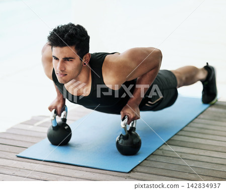 Push up, kettlebell or man in fitness exercise, training or workout for wellness, routine or balance. Ready, abs challenge or serious athlete with strong arms for muscles, activity or body mobility Push up, kettlebell or man in fitness exercise, training or workout for wellness, routine or balance. Ready, abs challenge or serious athlete with strong arms for muscles, activity or body mobility 142834937