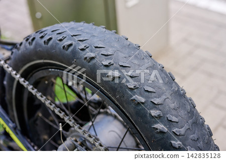 Extreme wear of a fat bike rear tire close up Extreme wear of a fat bike rear tire close up 142835128