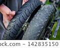 Examining the difference between new and worn bicycle tires 142835150