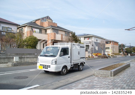 Delivery truck driving on the road Delivery truck driving on the road 142835249