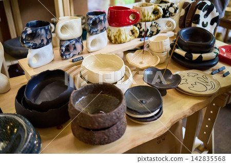 Handmade Ceramic Pottery Display at Craft Market Handmade Ceramic Pottery Display at Craft Market 142835568