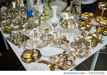 Vintage Silver Tableware and Decorative Items Display Vintage Silver Tableware and Decorative Items Display 142835569