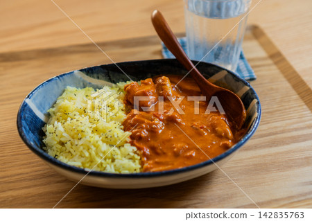 A delicious-looking chicken curry, ready to be scooped with a spoon. A delicious-looking chicken curry, ready to be scooped with a spoon. 142835763