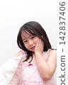 A 5-year-old girl wearing a nightgown 142837406