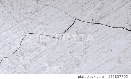 White concrete wall with a network of fine cracks. 142837705