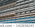 Scaffolding work at a large-scale demolition site 142838245