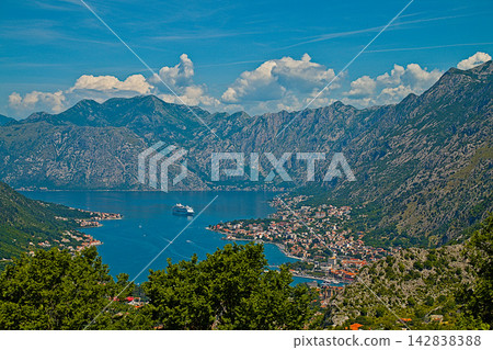 Panoramic view of Kotor Bay and mountains in Montenegro on a sunny summer day. Panoramic view of Kotor Bay and mountains in Montenegro on a sunny summer day. 142838388
