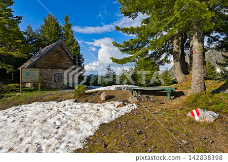 Old stone cabin in Prokletije National Parkwith snow and green forest landscape Old stone cabin in Prokletije National Parkwith snow and green forest landscape 142838398