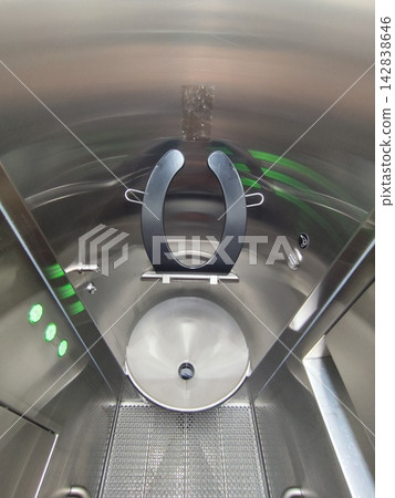 Modern public toilet cabin. Automatic metal WC restroom. Closet interior, lavatory basin and sink Modern public toilet cabin. Automatic metal WC restroom. Closet interior, lavatory basin and sink 142838646
