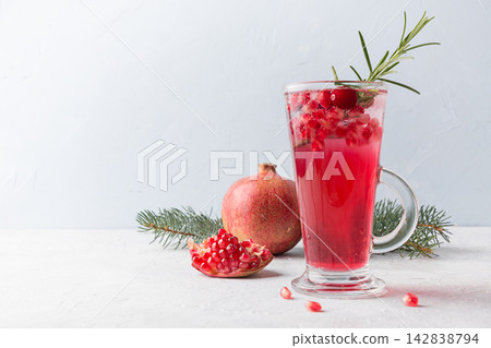 Pomegranate Christmas cocktail with rosemary, cranberry. Xmas drink. Pomegranate Christmas cocktail with rosemary, cranberry. Xmas drink. 142838794
