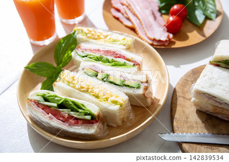 A healthy breakfast of sandwich and fresh juice A healthy breakfast of sandwich and fresh juice 142839534