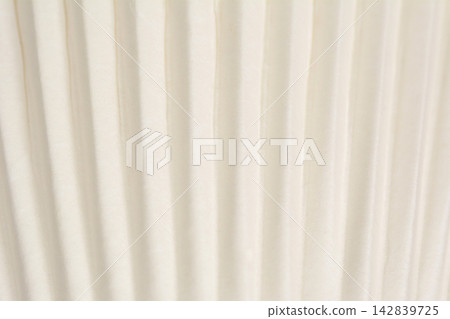 Texture of a white pleated paper cupcake liner Texture of a white pleated paper cupcake liner 142839725