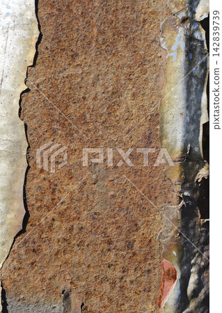 Texture of heavily rusted metal with peeling silver and red paint Texture of heavily rusted metal with peeling silver and red paint 142839739